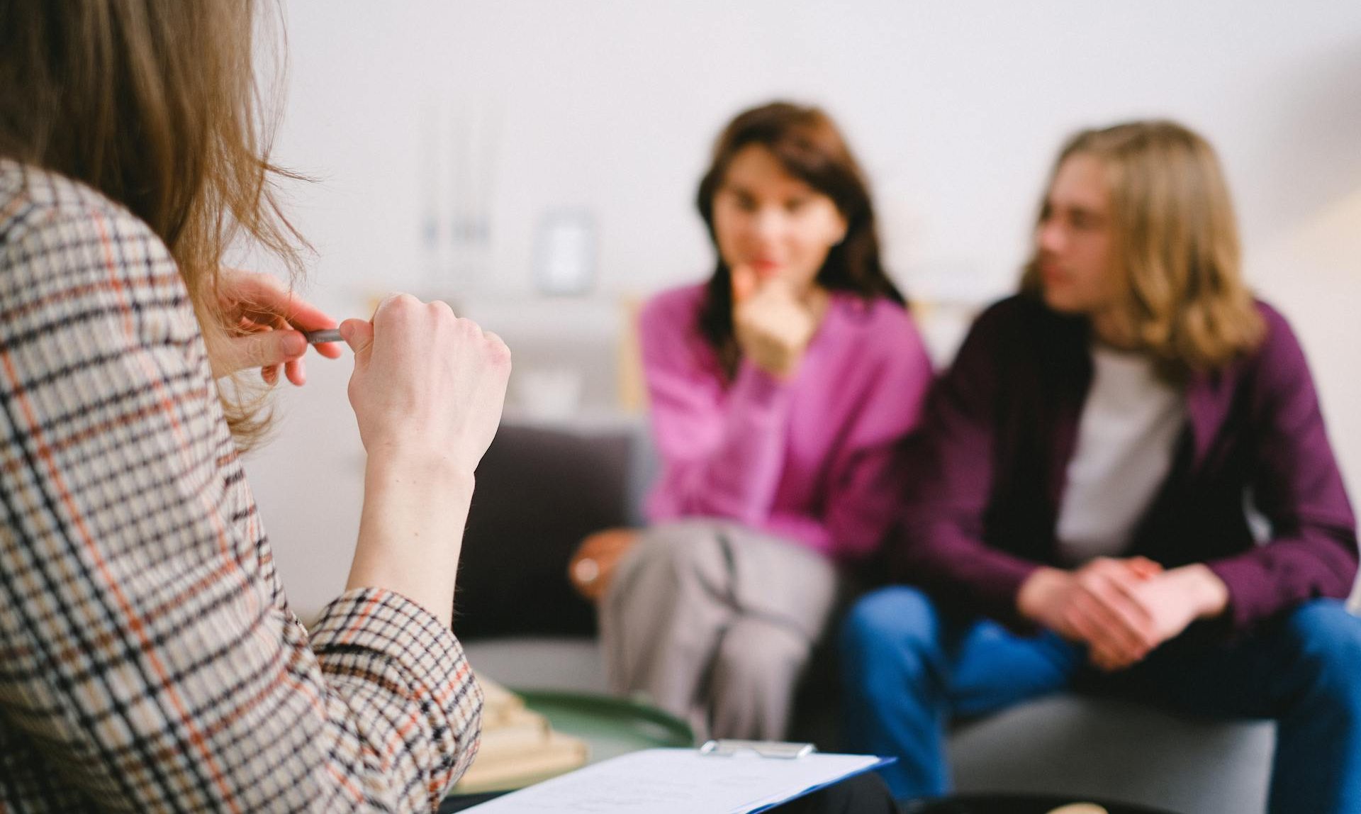 Therapist sitting with a client in a counselling session Therapist sitting with a client in a counselling session